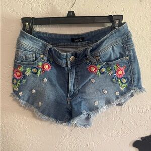 Floral stitched jean shorts